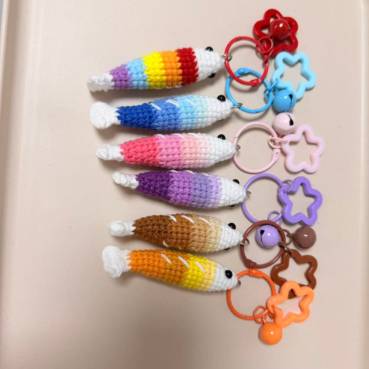 Rainbow lineup of all six fish keychains